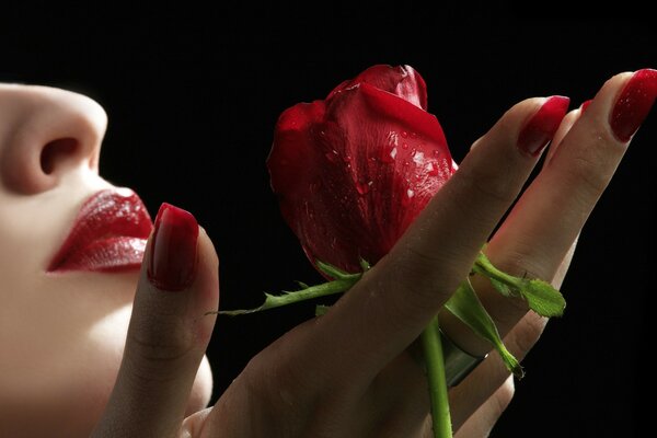 A girl with a red rose in her hand