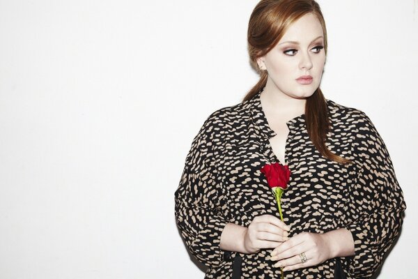 Singer Adele with a rose in her hands