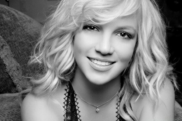 Britney smiles in a black and white photo