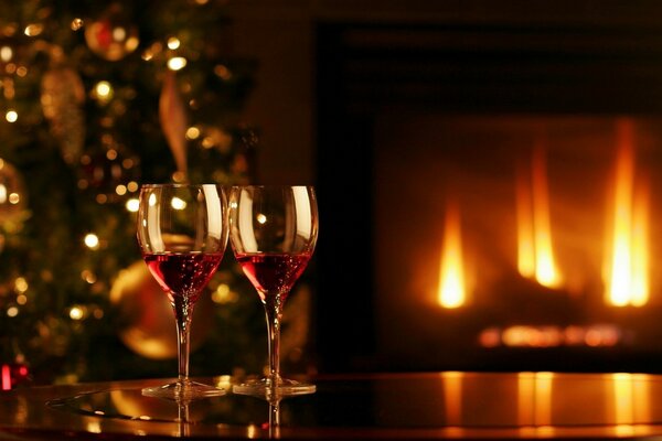 The warmth of the fireplace in the reflection of wine glasses