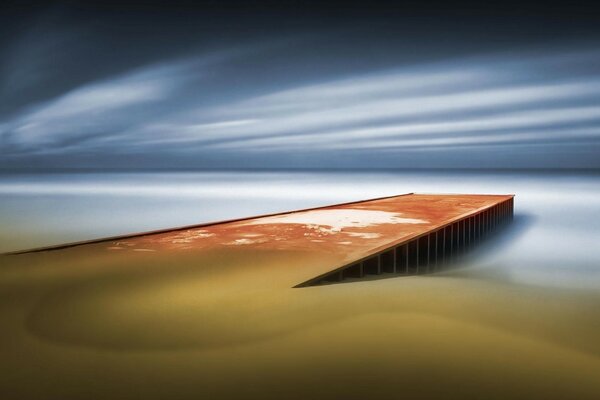 The gloomy sky over the watery surface