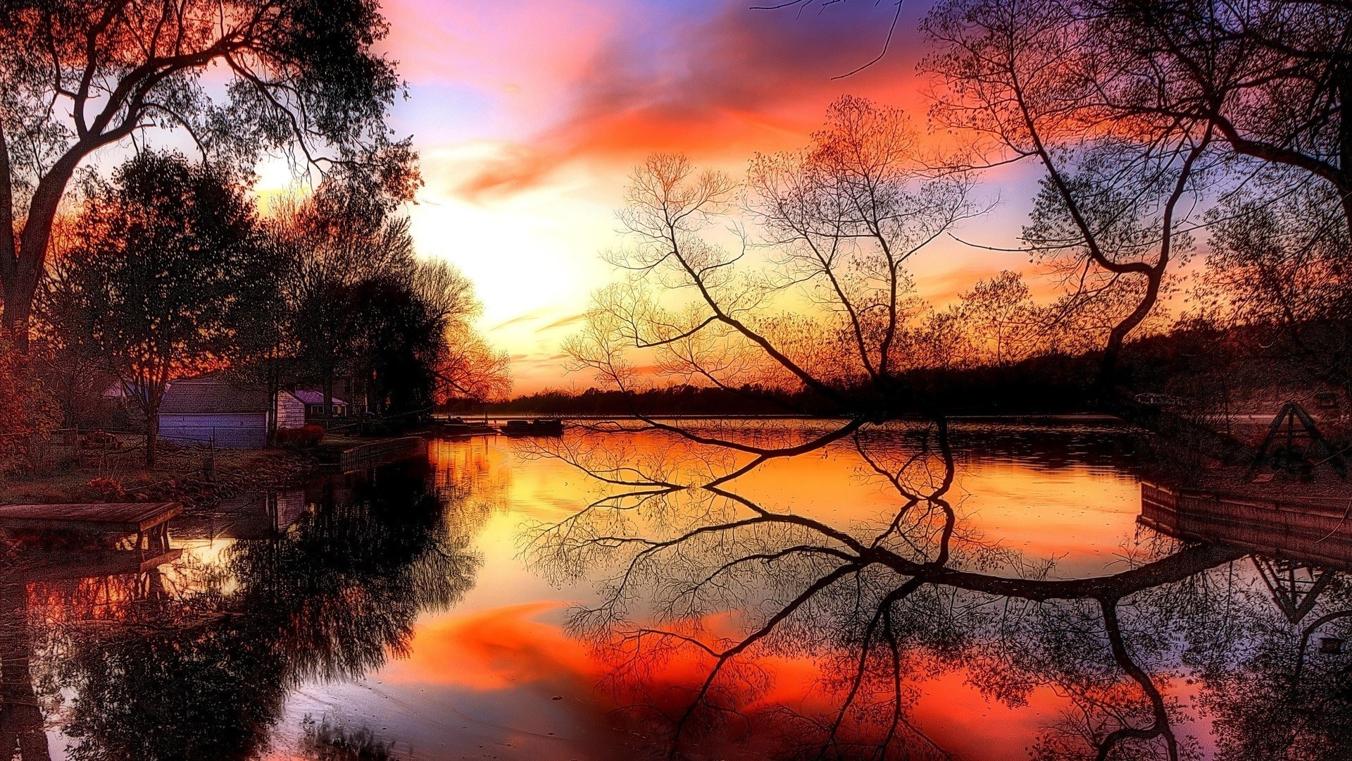 the sunset and sunrise sunset dawn evening landscape dusk nature reflection tree sun water bright fall light sky color outdoors