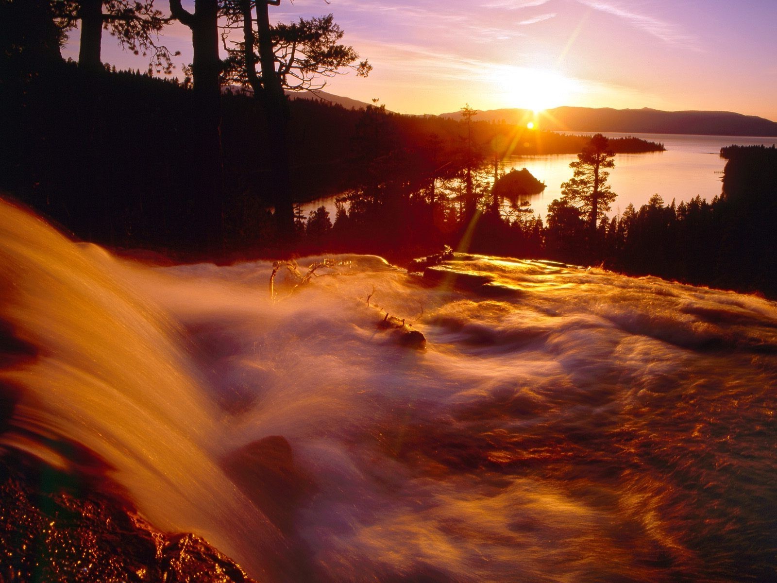 the sunset and sunrise sunset dawn evening water dusk landscape sun light nature reflection sky tree beach outdoors travel river fair weather