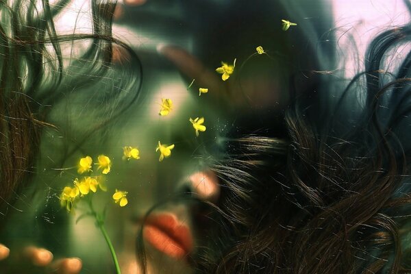 Photo with flowers and a face in the background