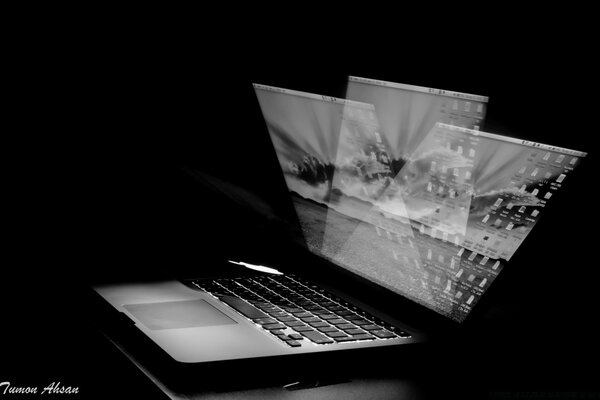 Monochrome laptop on a black background