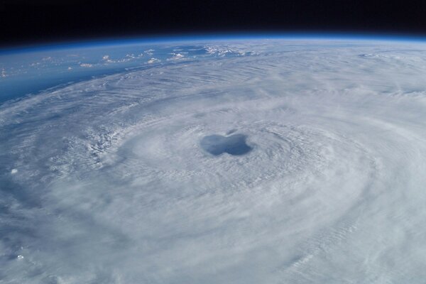 A picture from space of a cyclone in the form of an apple logo