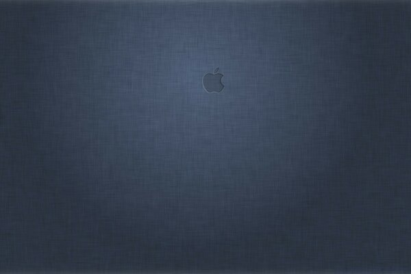 Mac logo on desktop with fabric texture