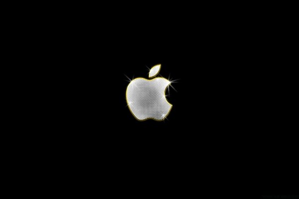 A silver-colored apple on a black background