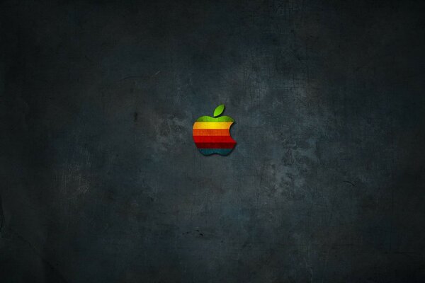 Multicolored apple apple on a dark gray background