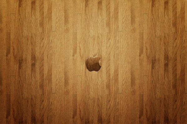 Logotipo de Apple en la superficie de madera