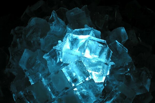 Ice cubes on a dark background with backlight