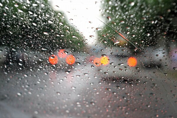 Raindrops on the windshield of the car