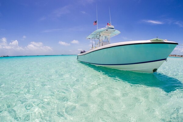 The yacht is going on a cruise on the turquoise ocean