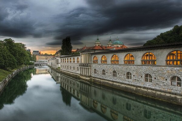 Architecture of the foggy city on the river