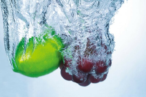 Wet fruits falling into the water