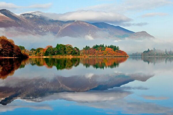 Mountains and forest in the reflection of the lake