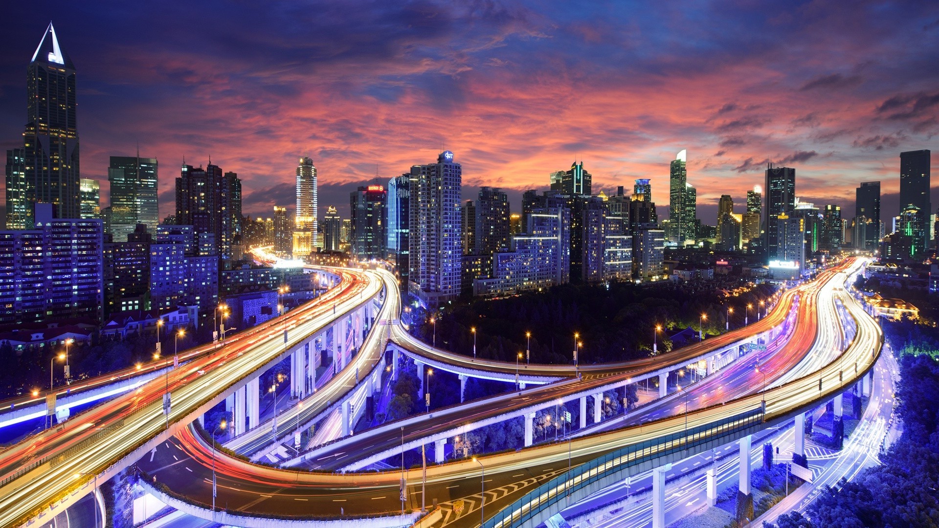 miasta i architektura zmierzch śródmieście ruch wieczór architektura miasto podróże wieżowiec miasto oświetlony nowoczesny dom autostrada system transportu miejski most skyline rozmycie szybki