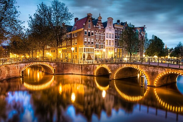 Architecture of the city bridge in the reflection of water