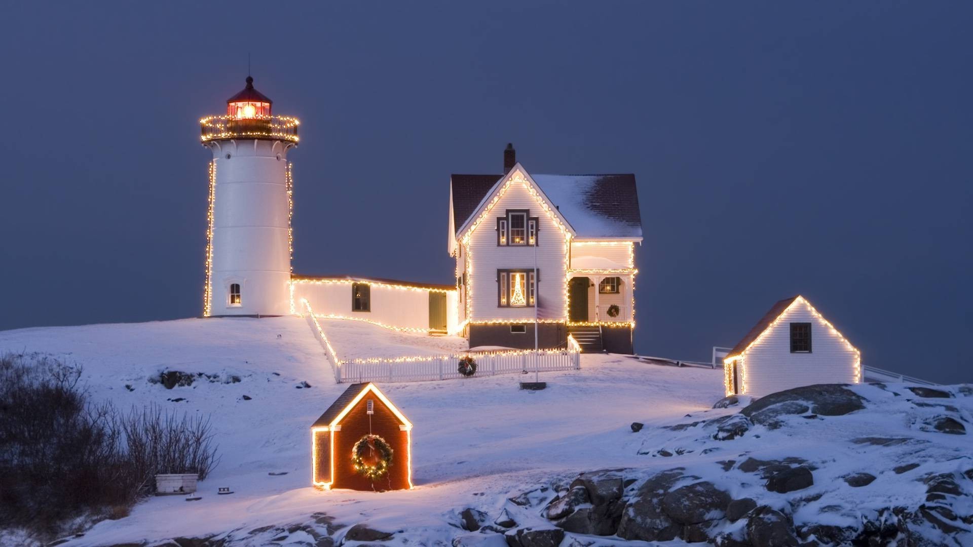 christmas architecture house building outdoors winter snow travel sky daylight landscape light evening lighthouse home scenic seashore church