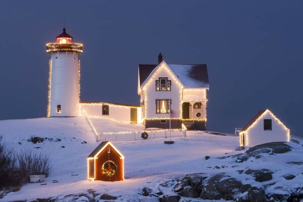 Winter landscape lighthouse on the hill