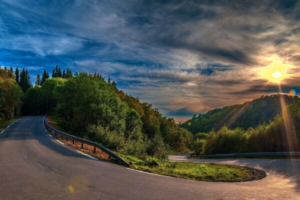 Bend the road at a turn in a beautiful hilly area