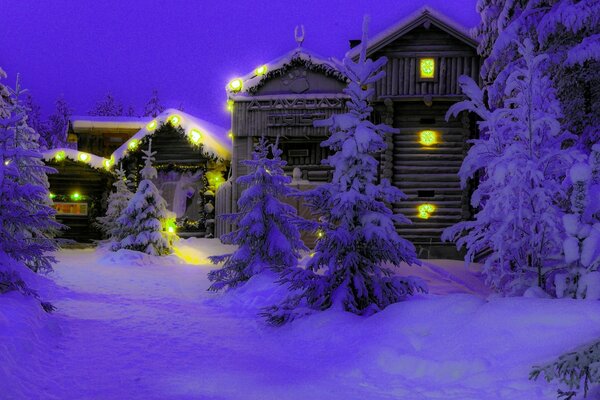 Ambiente de invierno navideño de casas con árboles de Navidad