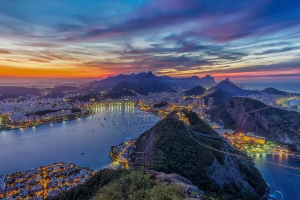 Landscape of the evening city near the mountains