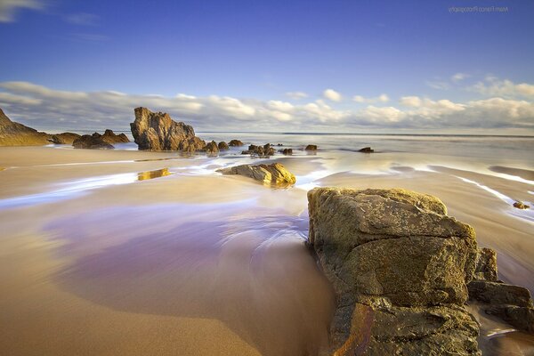 Rocks and boulders against a cloudy sky