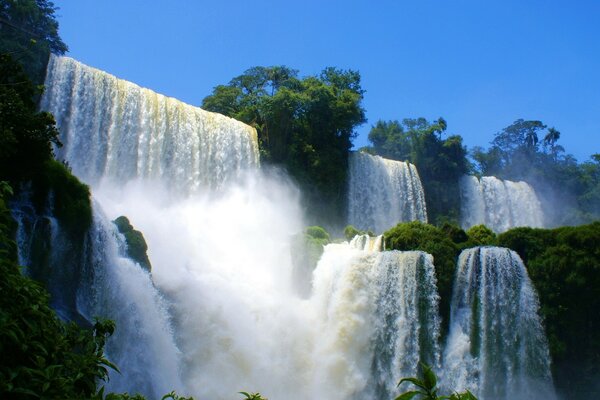 A powerful waterfall in spray and foam