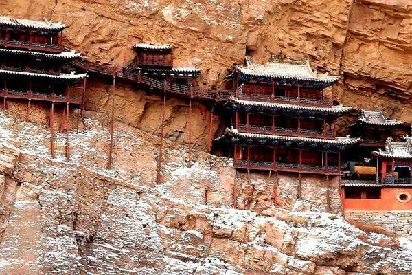 Houses in the rock covered with snow