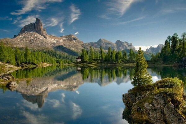 Mountains and trees are reflected in the lake