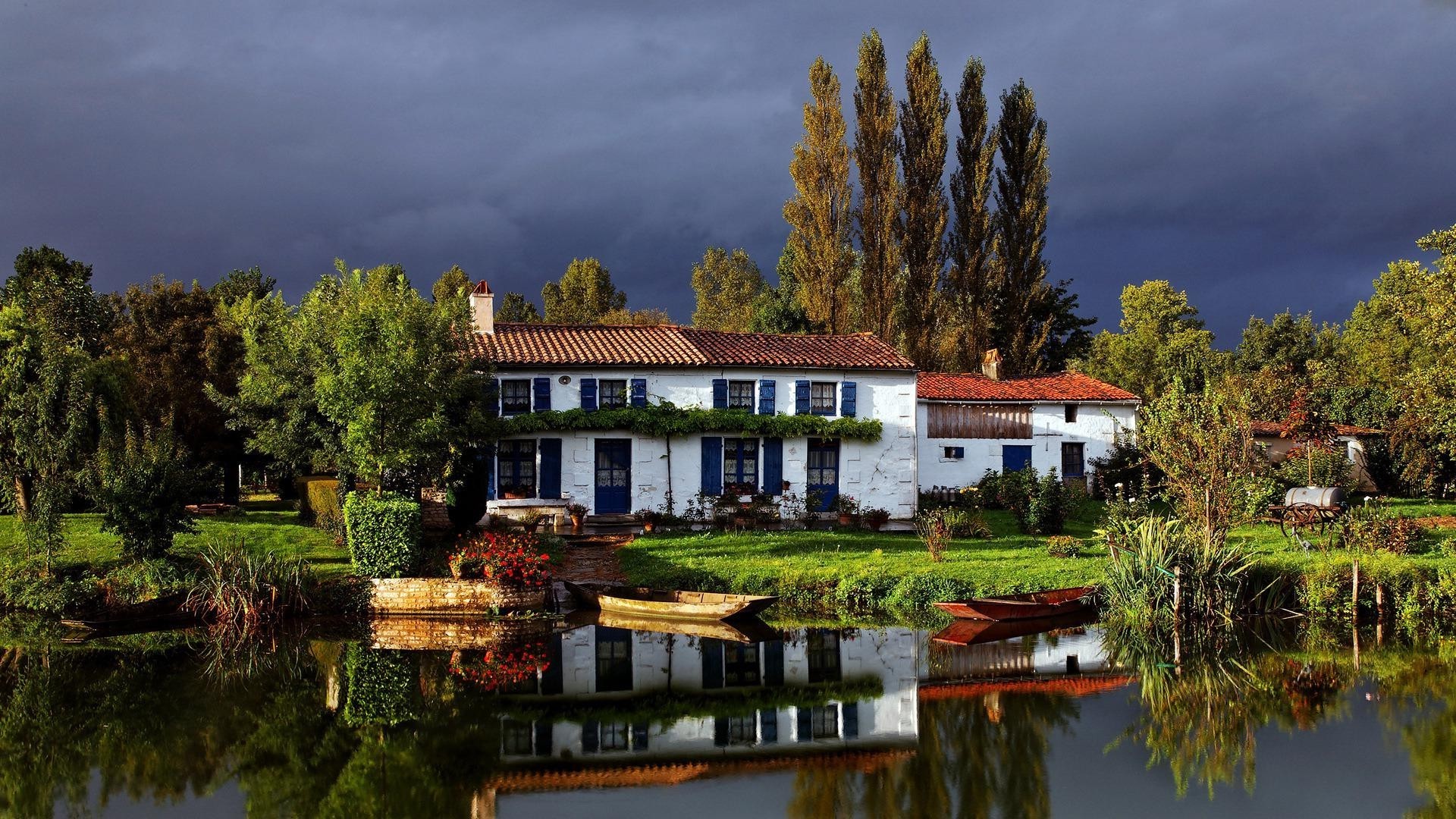 houses and cottages water house lake architecture home building outdoors tree travel reflection river pool sky daylight wood traditional