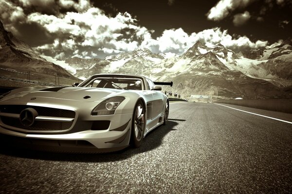 Mercedes on the road against the background of mountains