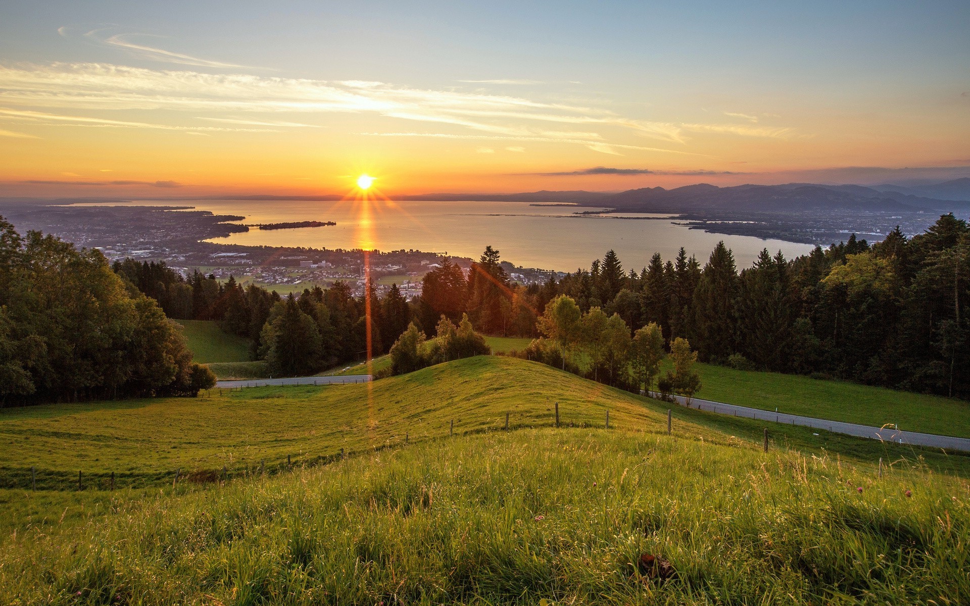 the sunset and sunrise landscape tree nature sunset dawn sky water scenic lake travel grass outdoors evening mountain hill wood light river sun