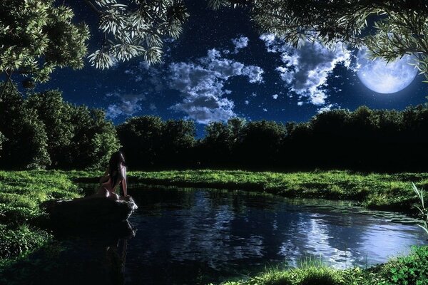 A girl in the summer in the lake under the night light of the moon