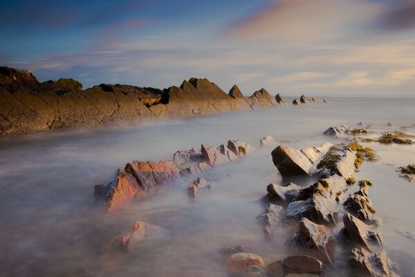 Landscape of a rocky shore by the water