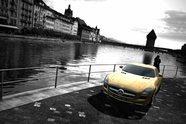 Yellow car on the background of a noir city