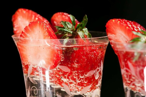 Strawberries in a glass with air bubbles