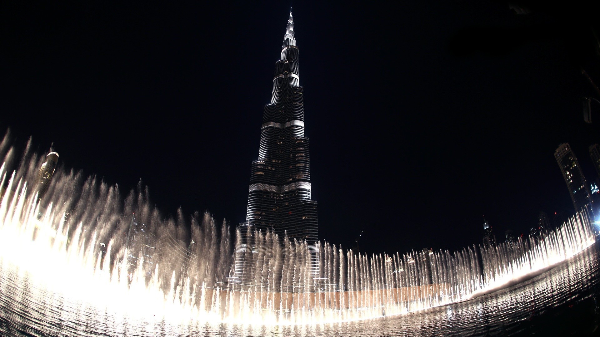 fountains architecture city travel building sky outdoors vehicle water tower light urban dusk cityscape