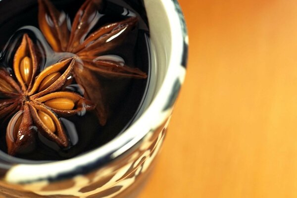 Fragment of a cup with a drink and spices