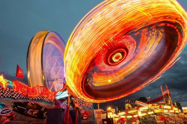 A children s carousel in the park turns into a fire wheel