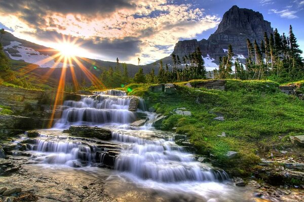 Landscape with mountains, trees and waterfall