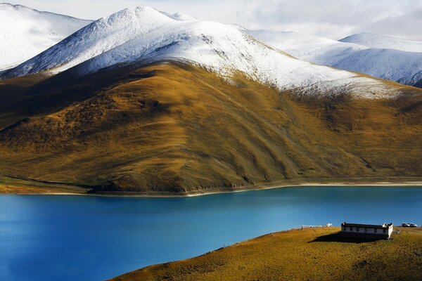 Snow-covered hills of mountains near the river