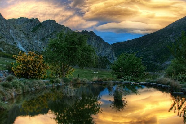 Mirror pond in the middle of the mountains