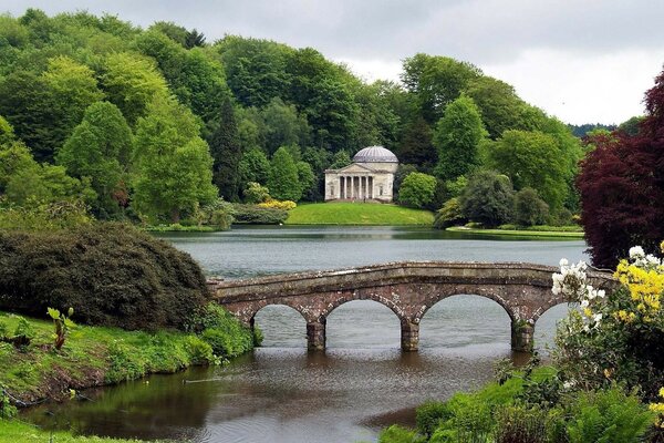 Old bridge across the river in nature