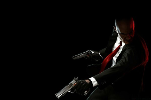 Cool man with guns on a dark background