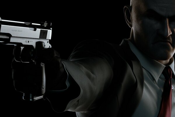 Cool man with a gun on a dark background