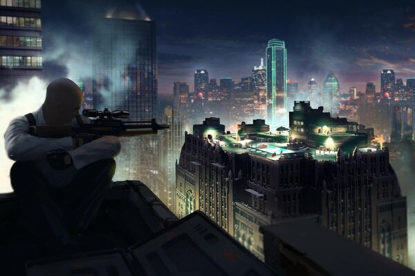 A fighter with a machine gun sits on the roof and looks at the city