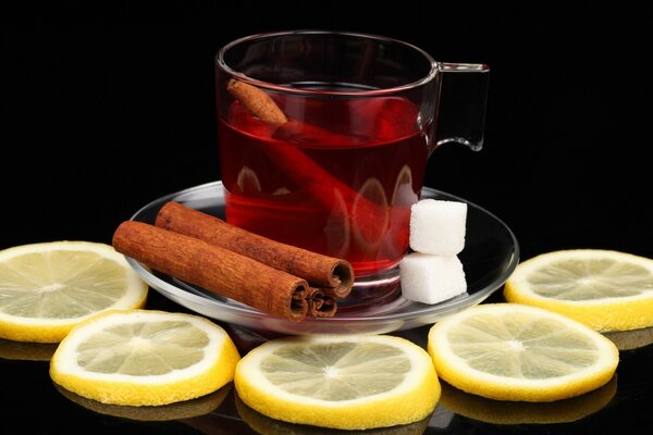 Tea with lemon and cinnamon sticks