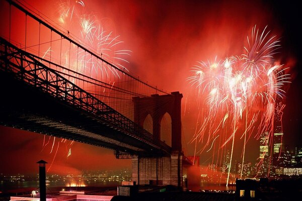 Red fireworks and a beautiful bridge